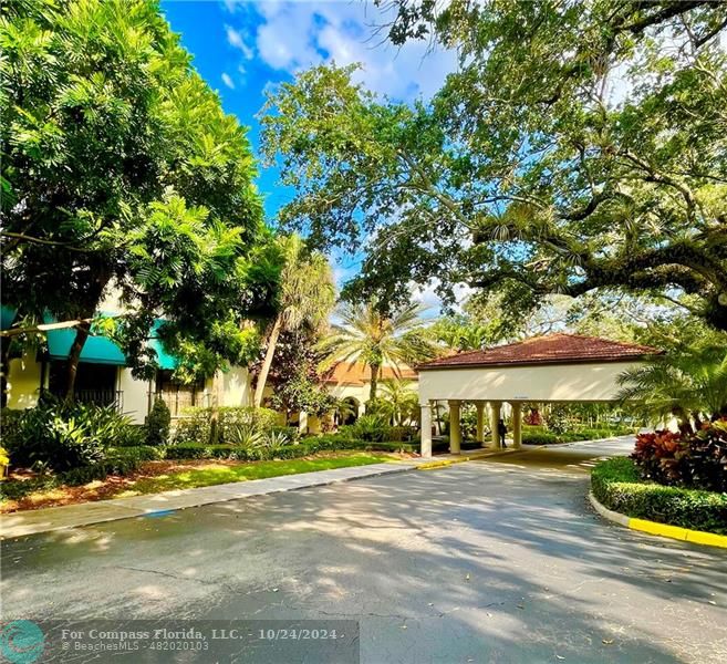 9495 Evergreen Place, Unit 405 Davie, FL 33324 - Photo 13 of 17 a front view of a house with a yard