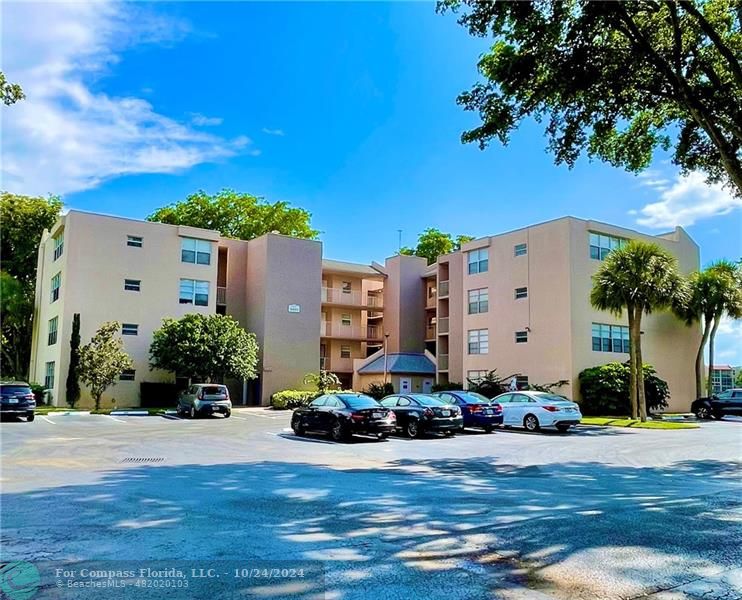 9495 Evergreen Place, Unit 405 Davie, FL 33324 - Photo 8 of 17 a building view with a outdoor space