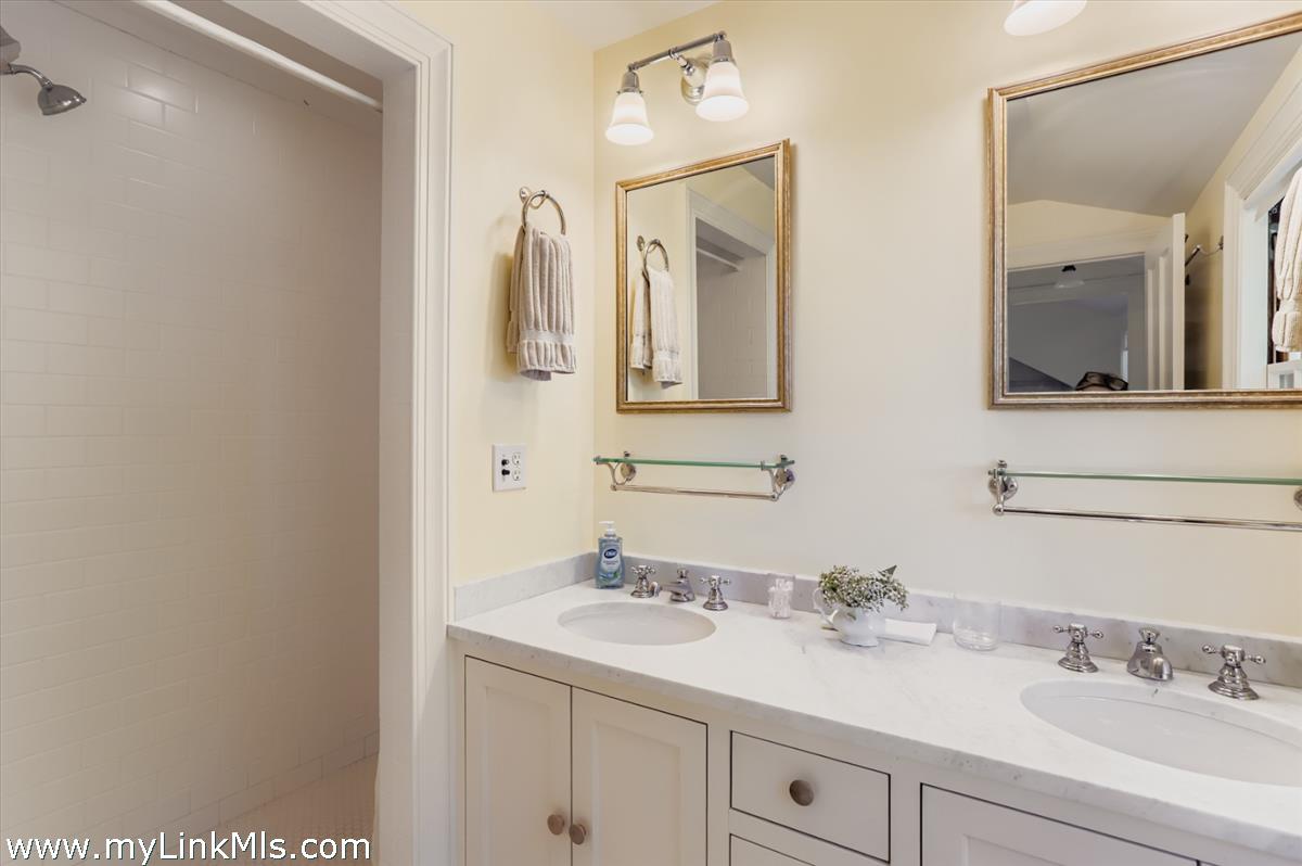 27 Spring Street Vineyard Haven, MA 02568 - Photo 44 of 58 a bathroom with a sink and a mirror