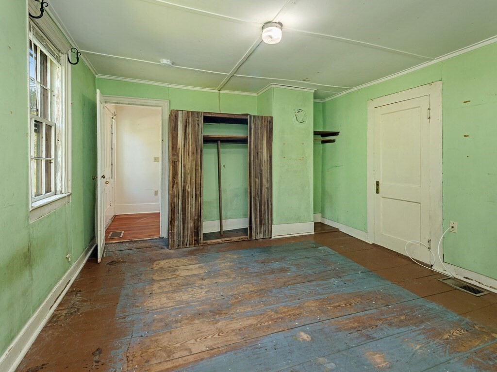 194 Wales Road Brimfield, MA 01010 - Photo 16 of 42 an empty room with closet and mirror