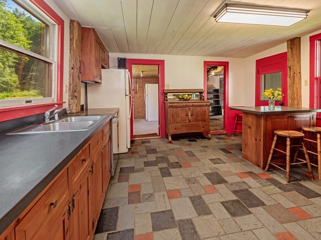 194 Wales Road Brimfield, MA 01010 - Photo 5 of 42 a kitchen with stainless steel appliances kitchen island granite countertop a sink and cabinets