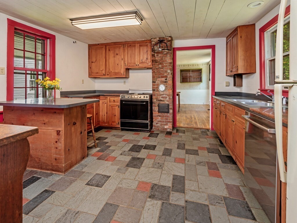 194 Wales Road Brimfield, MA 01010 - Photo 8 of 42 a kitchen with stainless steel appliances granite countertop a stove a sink and a refrigerator