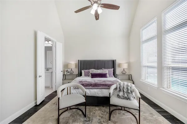 a bedroom with furniture and a window