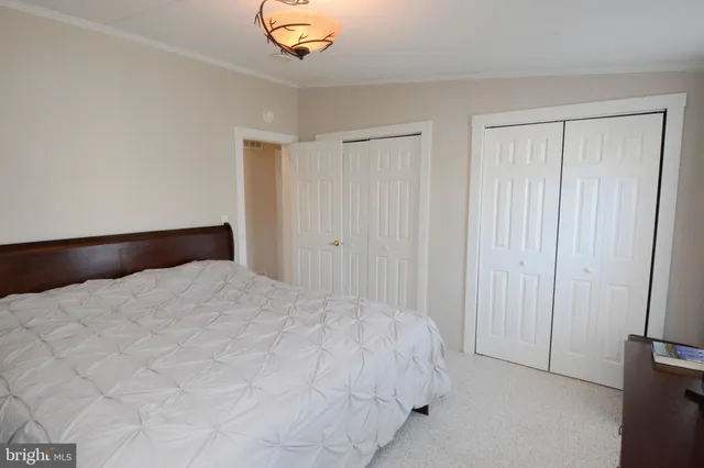 a large white bed in a white room