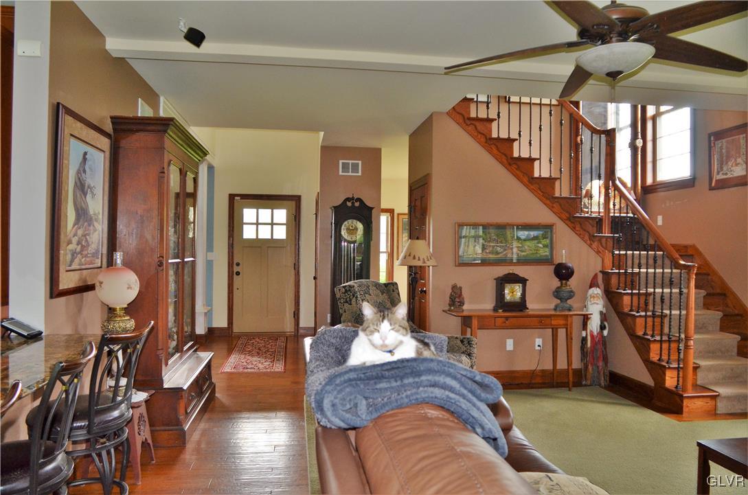 1983 Snyder Road Ulster, PA 18850 - Photo 15 of 50 a living room with furniture or wooden floor and a chandelier
