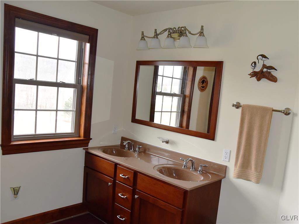 1983 Snyder Road Ulster, PA 18850 - Photo 31 of 50 a bathroom with a sink vanity and a mirror