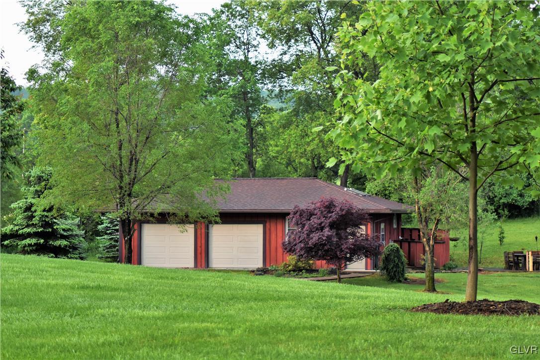 1983 Snyder Road Ulster, PA 18850 - Photo 4 of 50 a front view of a house with a garden