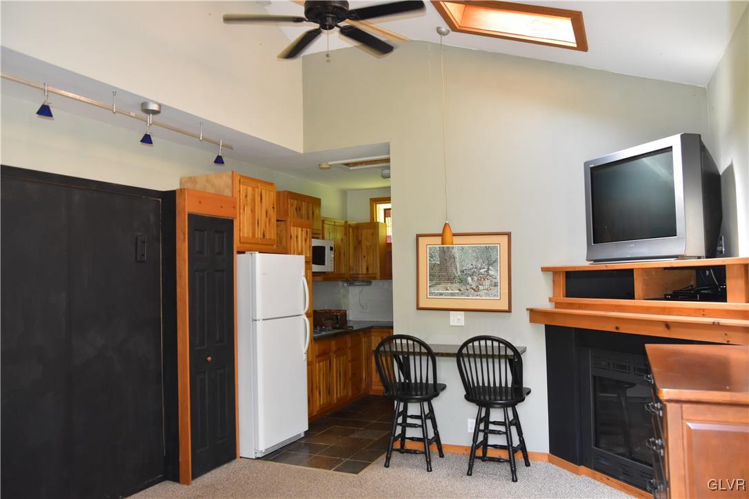 1983 Snyder Road Ulster, PA 18850 - Photo 44 of 50 a kitchen with stainless steel appliances a refrigerator and a dining table