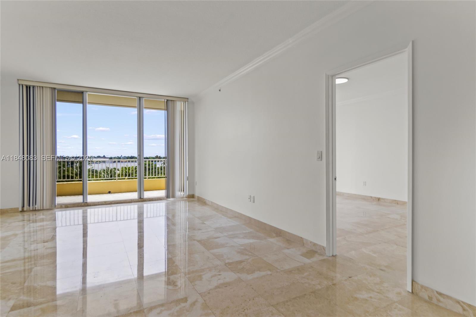 703 Crandon Boulevard, Unit PH3 Key Biscayne, FL 33149 - Photo 18 of 40 a view of an empty room and window
