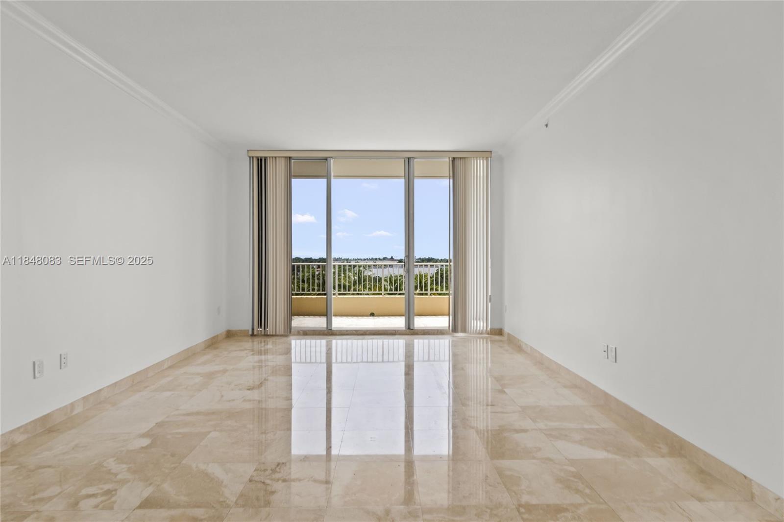 703 Crandon Boulevard, Unit PH3 Key Biscayne, FL 33149 - Photo 19 of 40 an empty room with large windows