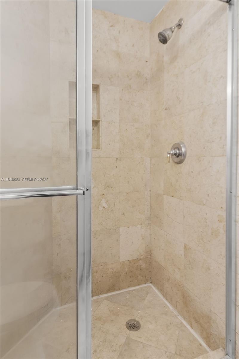 703 Crandon Boulevard, Unit PH3 Key Biscayne, FL 33149 - Photo 27 of 40 a bathroom with a shower