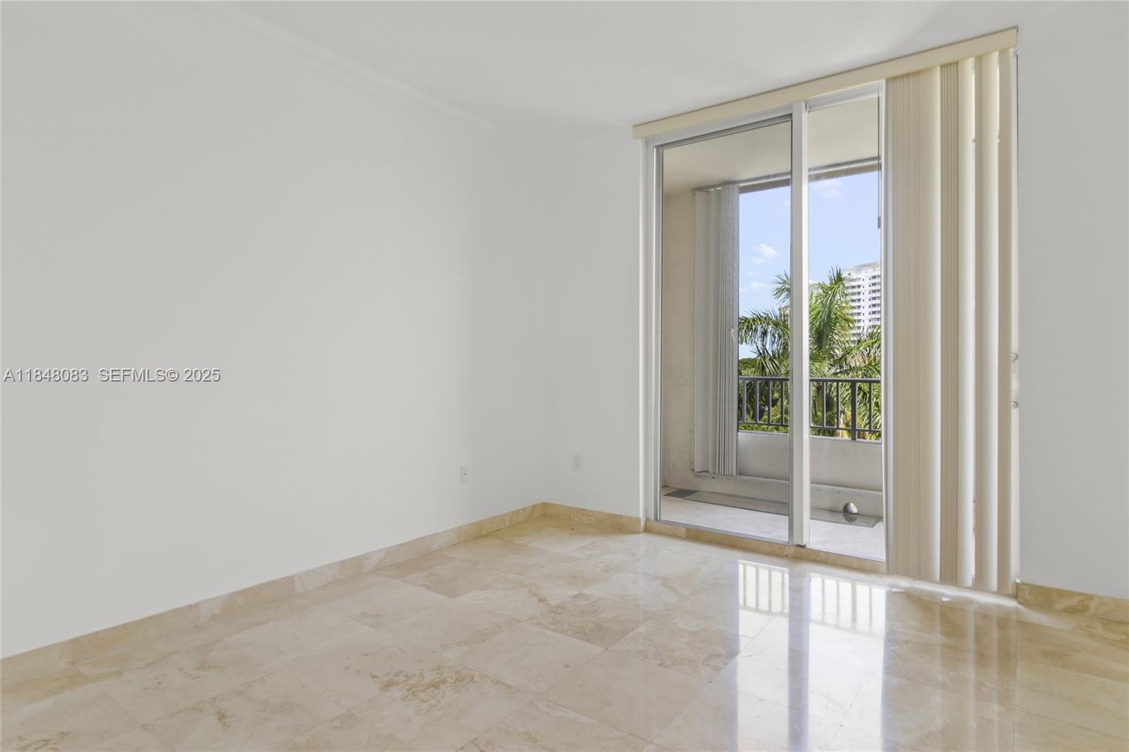 703 Crandon Boulevard, Unit PH3 Key Biscayne, FL 33149 - Photo 28 of 40 a view of an empty room with a window