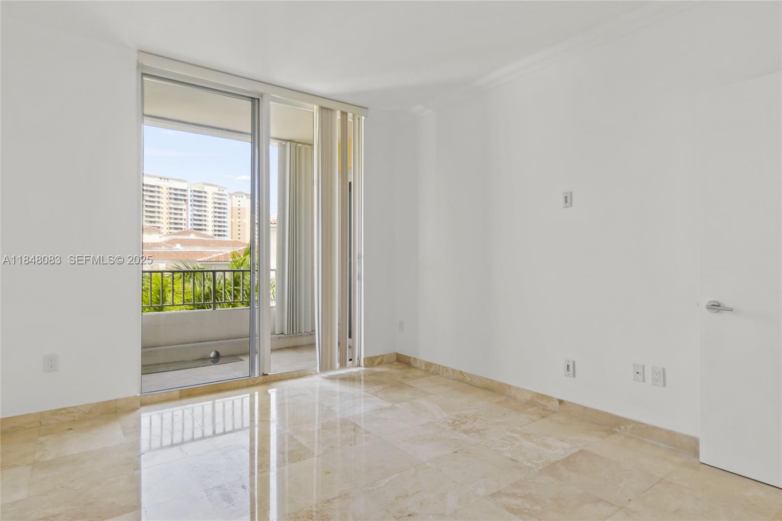 703 Crandon Boulevard, Unit PH3 Key Biscayne, FL 33149 - Photo 29 of 40 a view of an empty room with a window