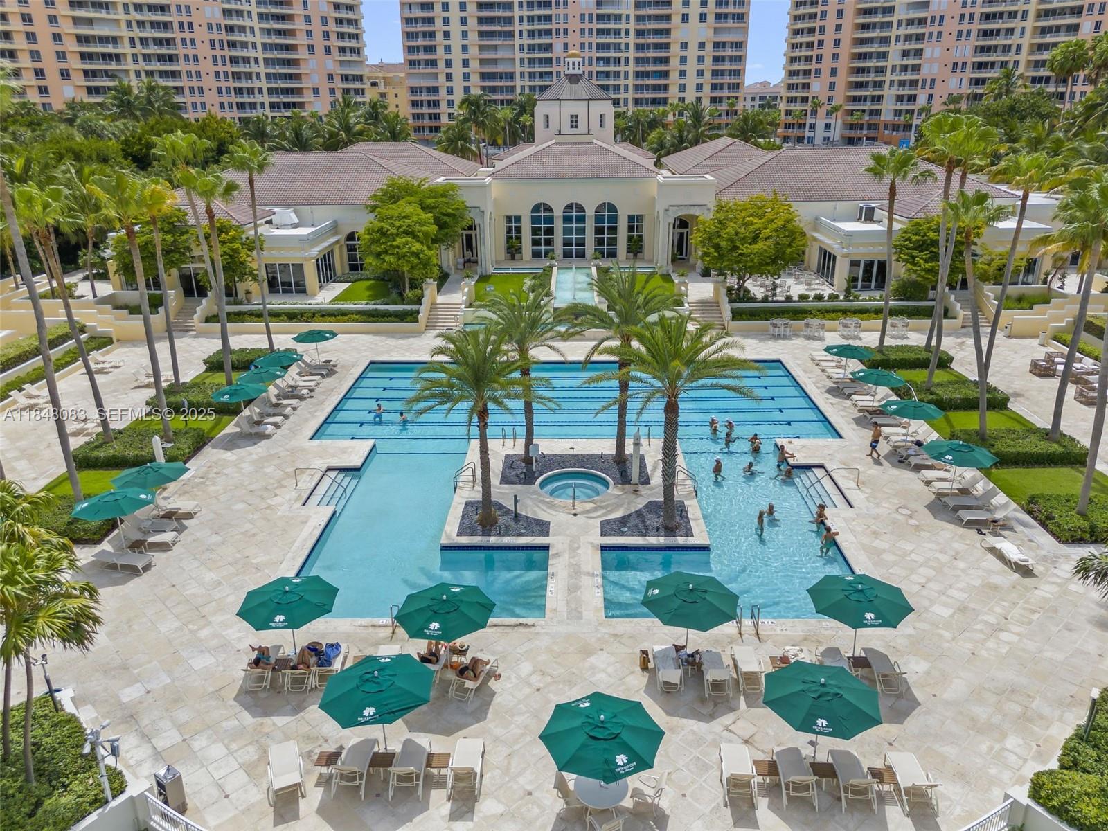 703 Crandon Boulevard, Unit PH3 Key Biscayne, FL 33149 - Photo 3 of 40 a front view of a building with garden