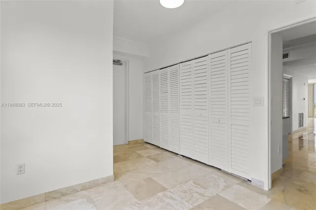 an empty room with a bench