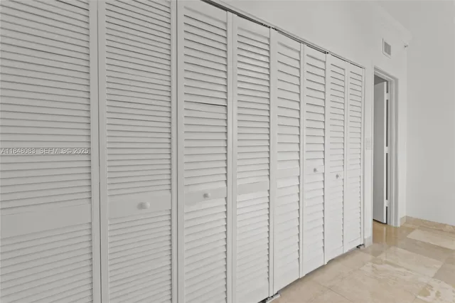 a view of a room with white walls