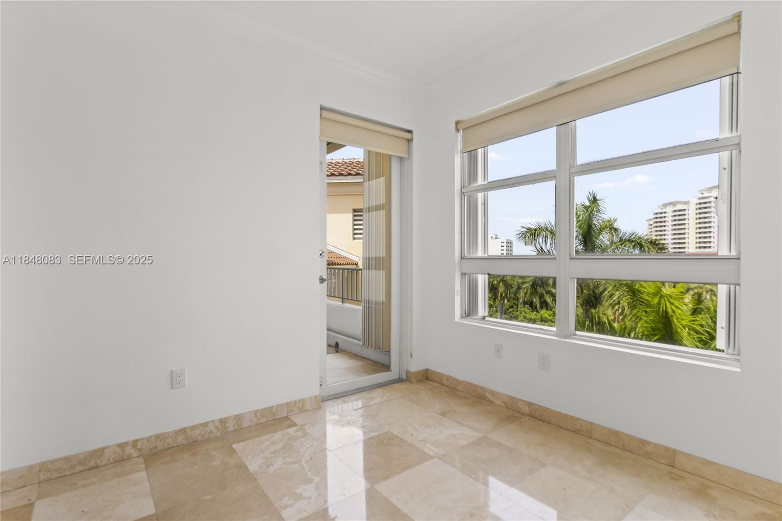 703 Crandon Boulevard, Unit PH3 Key Biscayne, FL 33149 - Photo 33 of 40 a view of an empty room with a window