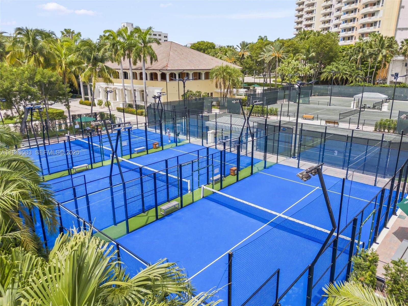 703 Crandon Boulevard, Unit PH3 Key Biscayne, FL 33149 - Photo 7 of 40 a view of a balcony with swimming pool and sitting area