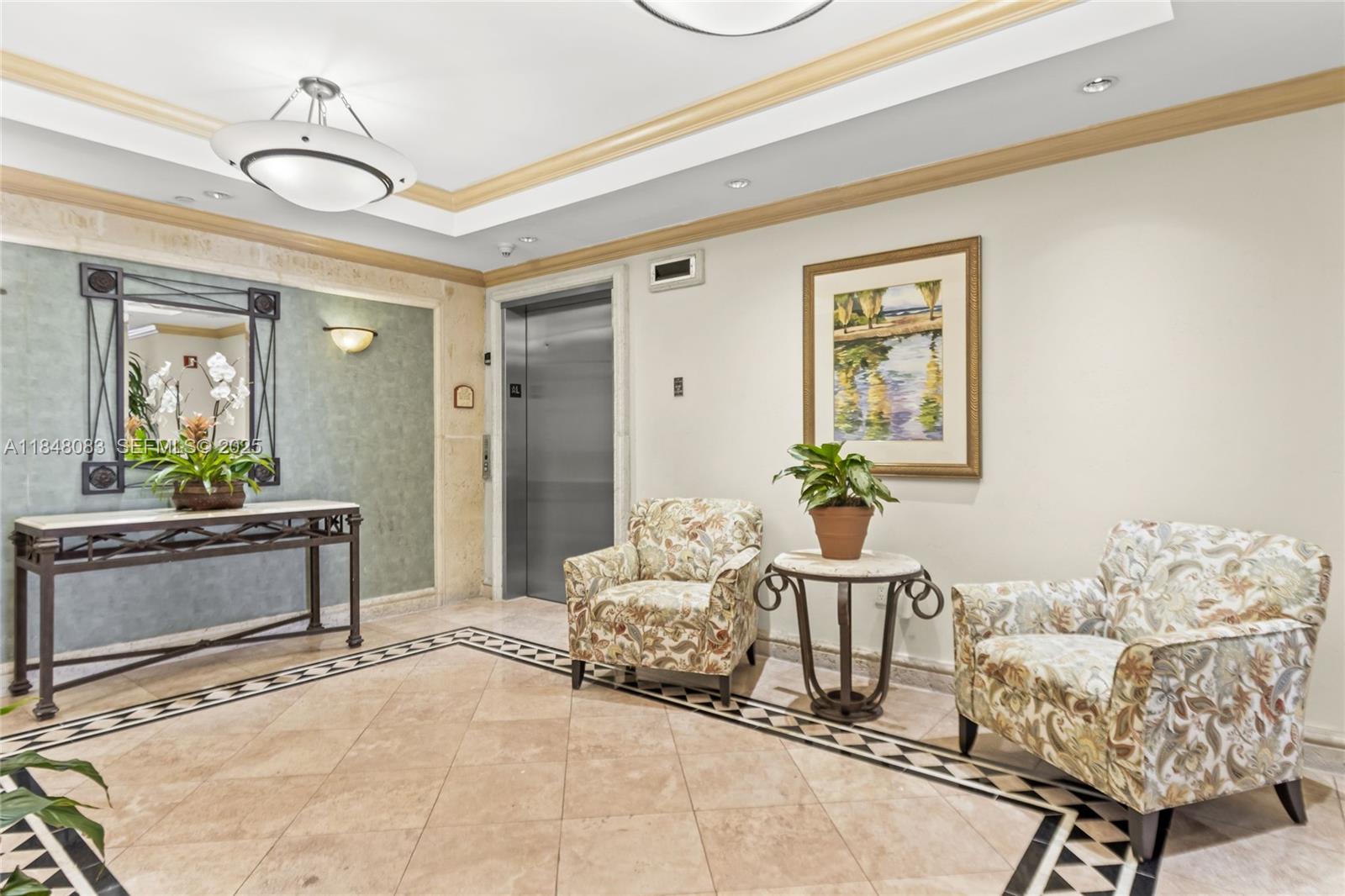 703 Crandon Boulevard, Unit PH3 Key Biscayne, FL 33149 - Photo 8 of 40 a living room with furniture and a potted plant