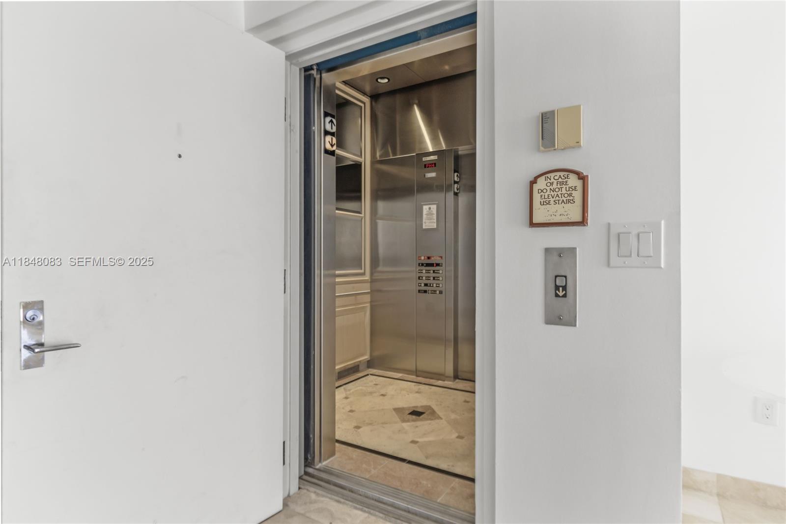 703 Crandon Boulevard, Unit PH3 Key Biscayne, FL 33149 - Photo 9 of 40 a bathroom with a glass shower door