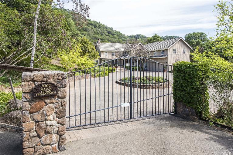 a view of a wrought iron fences in front of house