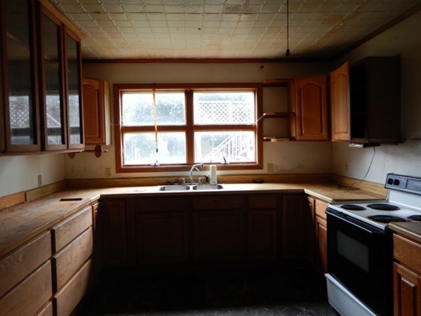 31-33 Aspen Street Ware, MA 01082 - Photo 12 of 31 a kitchen with a sink stove and microwave