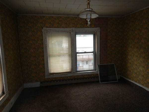 31-33 Aspen Street Ware, MA 01082 - Photo 19 of 31 a view of empty room with wooden floor and fan