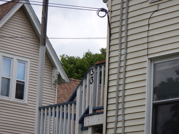 31-33 Aspen Street Ware, MA 01082 - Photo 20 of 31 a view of a balcony with wooden floor and stairs