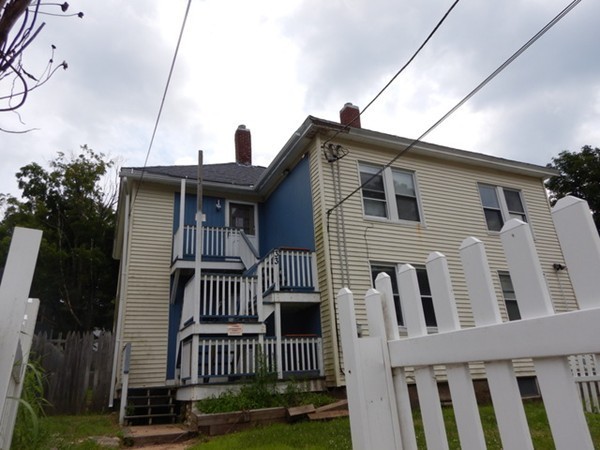 31-33 Aspen Street Ware, MA 01082 - Photo 2 of 31 a front view of a house with a yard