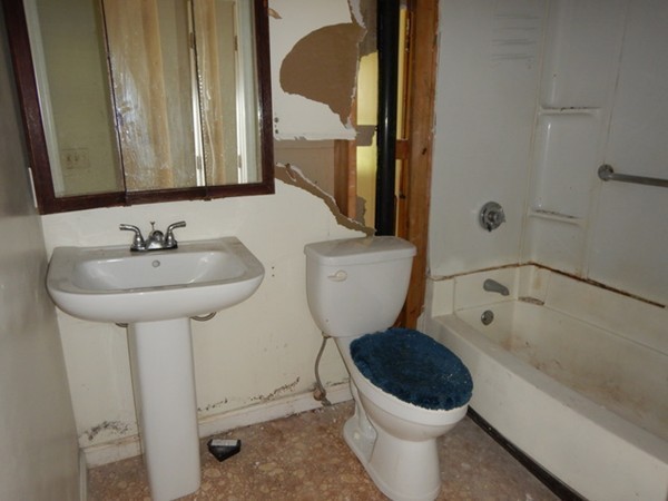 31-33 Aspen Street Ware, MA 01082 - Photo 24 of 31 a bathroom with a toilet sink and mirror