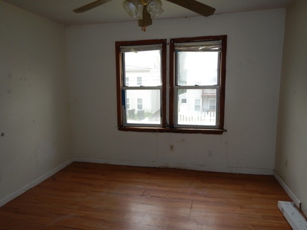 31-33 Aspen Street Ware, MA 01082 - Photo 26 of 31 an empty room with wooden floor and windows