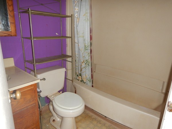31-33 Aspen Street Ware, MA 01082 - Photo 29 of 31 a white toilet sitting next to a bath tub