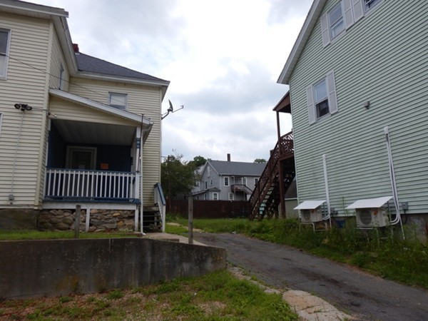 31-33 Aspen Street Ware, MA 01082 - Photo 3 of 31 a view of a porch with a yard