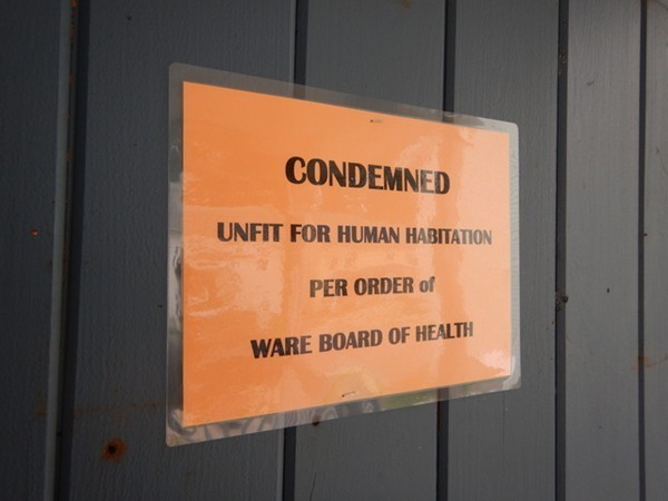 31-33 Aspen Street Ware, MA 01082 - Photo 5 of 31 a sign on the wall next to a window