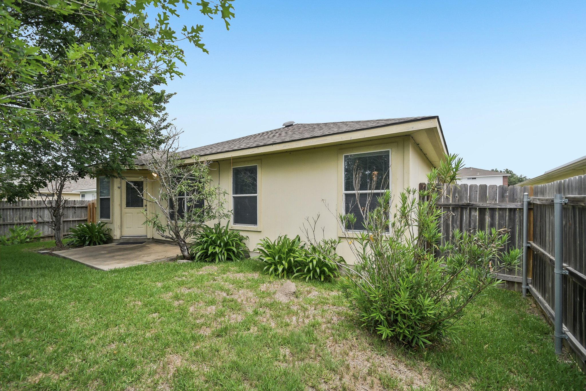 610 Lavaca Loop Elgin, TX 78621 - Photo 33 of 37 A private, fenced backyard offers a quiet space for outdoor enjoyment.