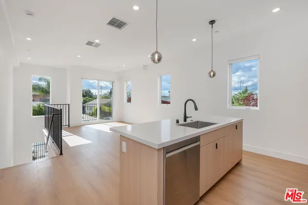 a kitchen with sink and window