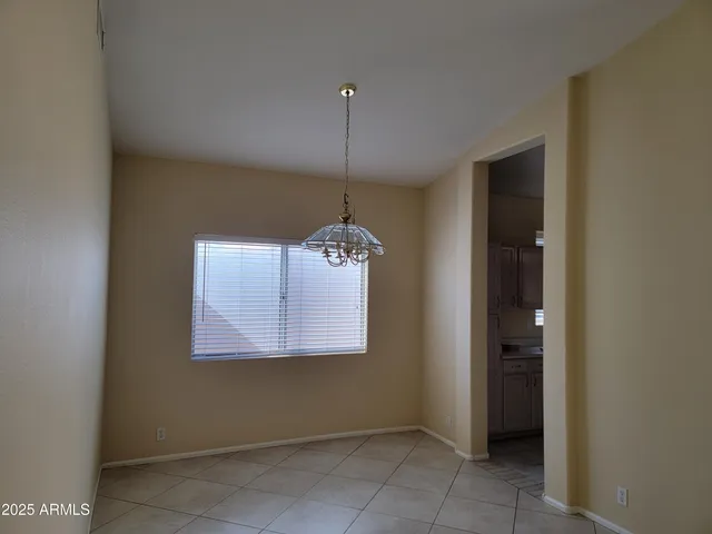 a room with window and a chandelier