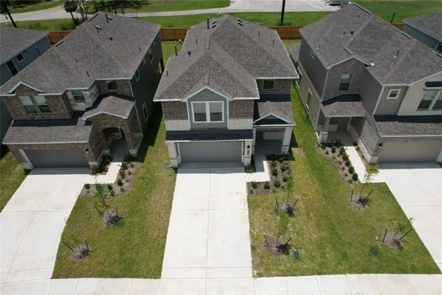 an aerial view of a house with a garden