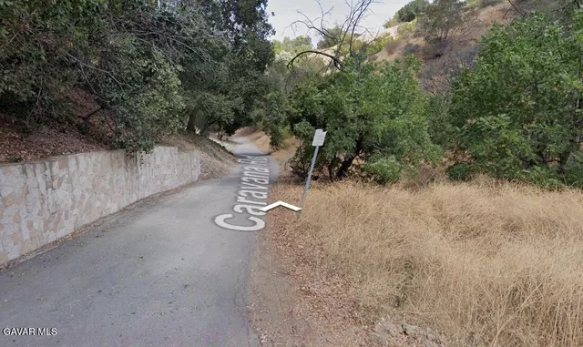 a view of a backyard with sitting area