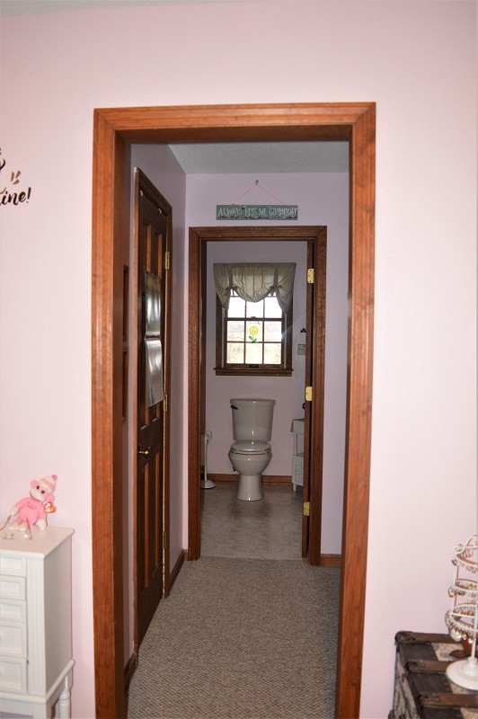 505 W Road Morrison, TN 37357 - Photo 23 of 44 a view of a hallway with wooden floor and a living room