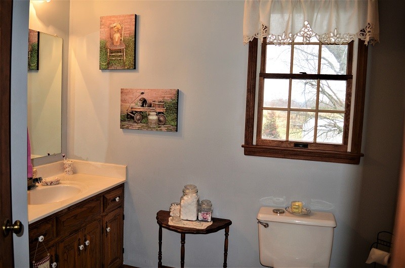505 W Road Morrison, TN 37357 - Photo 26 of 44 a bathroom with a sink mirror and toilet