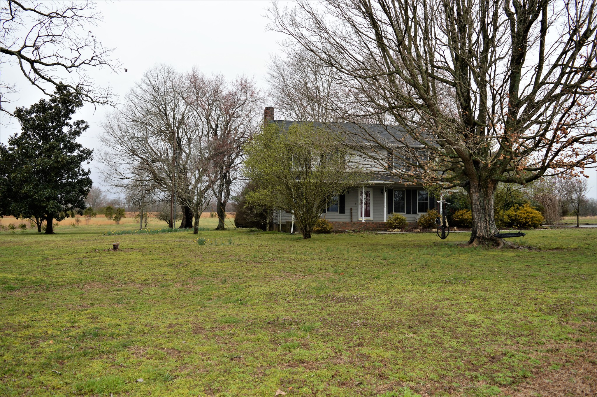 505 W Road Morrison, TN 37357 - Photo 3 of 44 a front view of a house with a garden