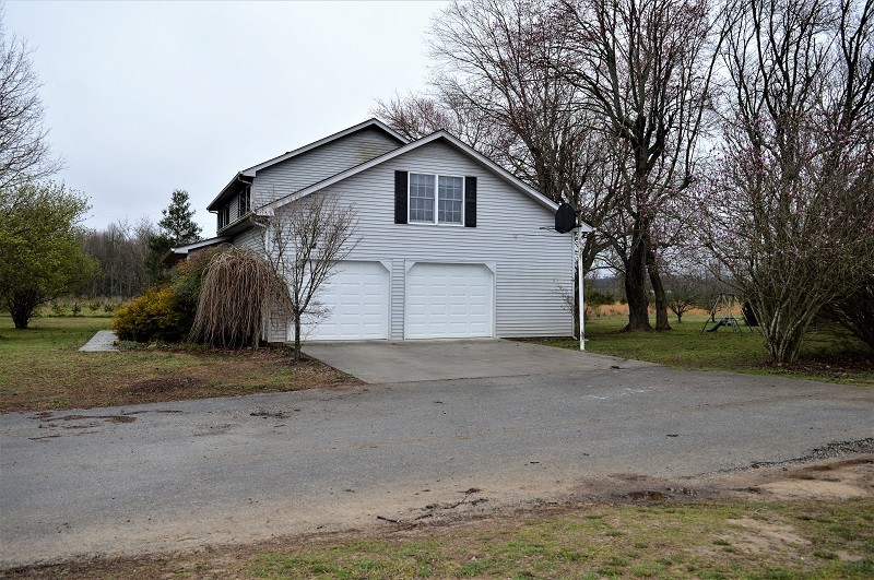 505 W Road Morrison, TN 37357 - Photo 32 of 44 a view of a house with a yard