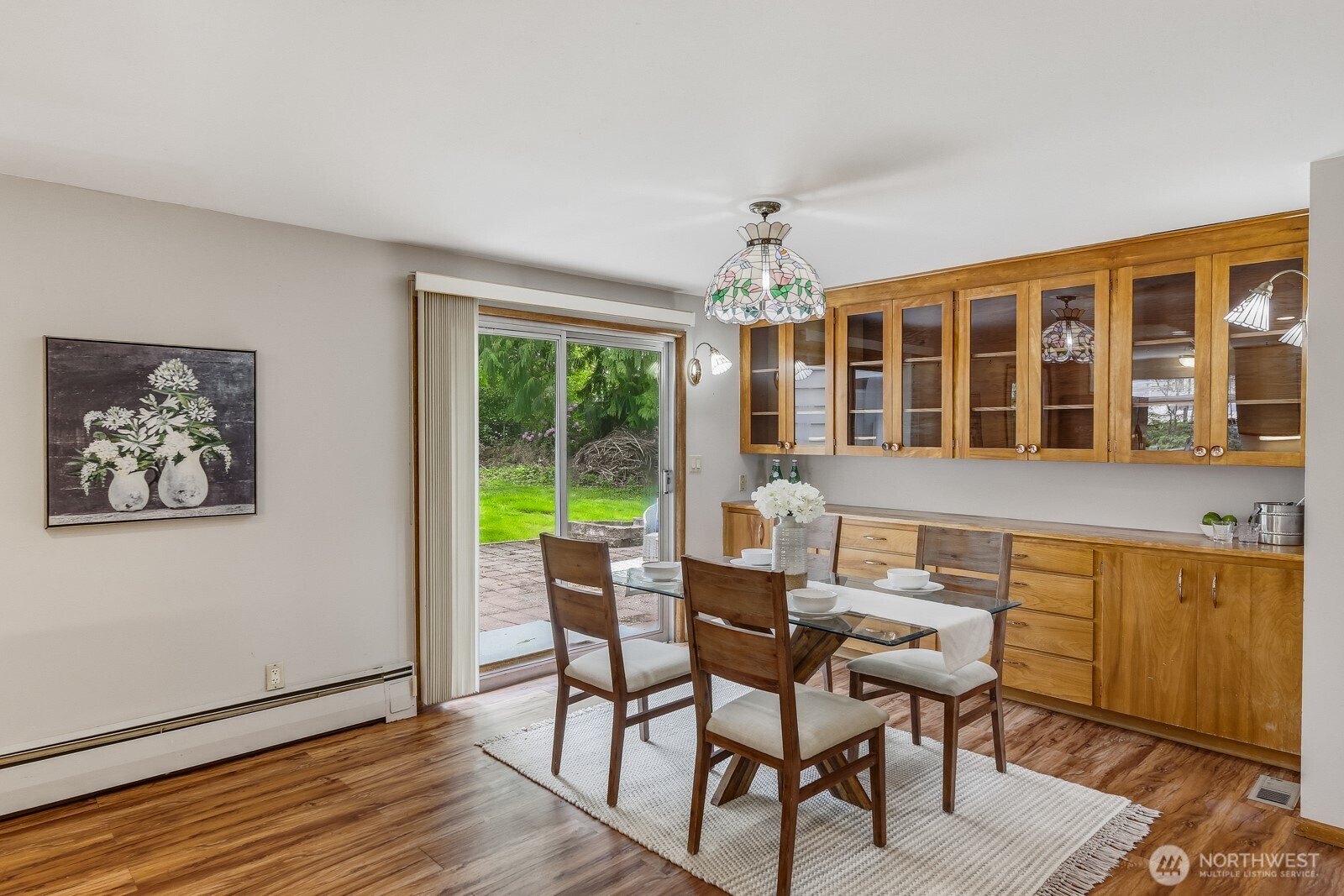 3822 Shelby Road Lynnwood, WA 98087 - Photo 11 of 40 a view of a dining room with furniture window and wooden floor