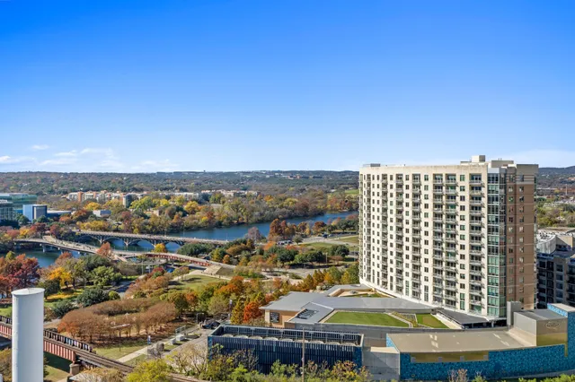 a view of a swimming pool with outdoor seating