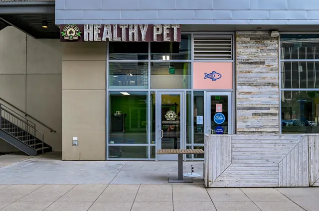 a view of a patio with couches table and chairs and potted plants