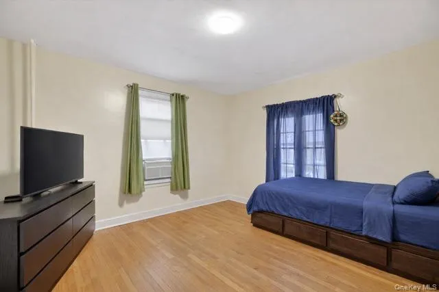 a bathroom with a toilet sink and shower curtain