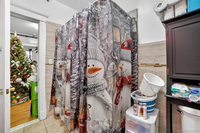 a living room with blue lights with furniture