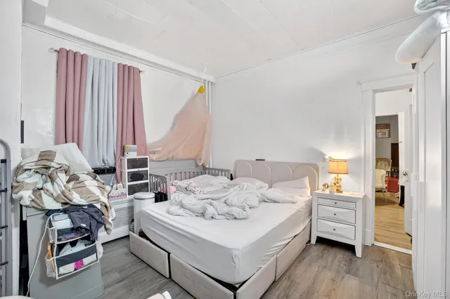 a bed room with furniture and a flat screen tv