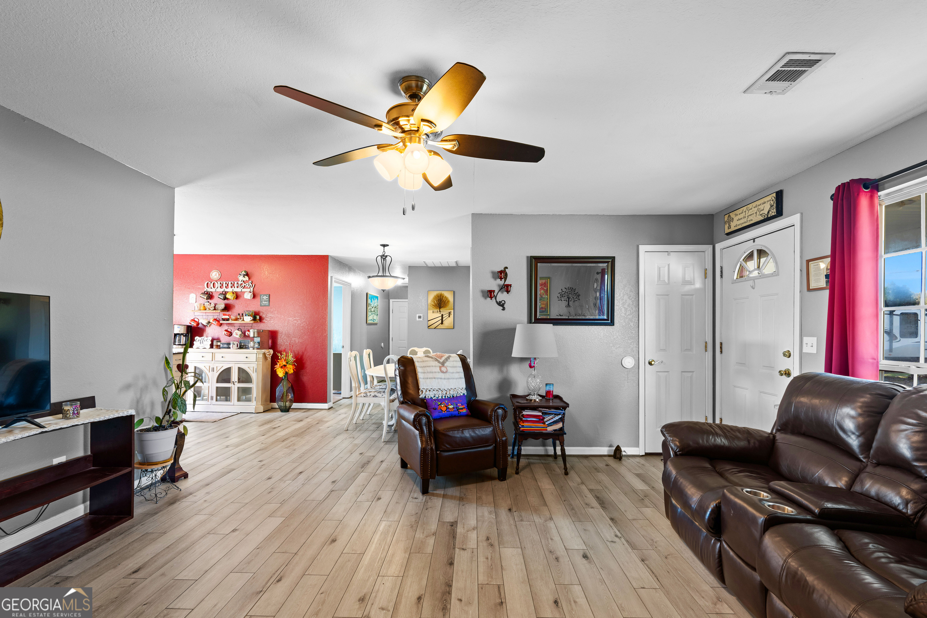 3939 Bevis Road Franklin, GA 30217 - Photo 11 of 40 a living room with furniture and a flat screen tv